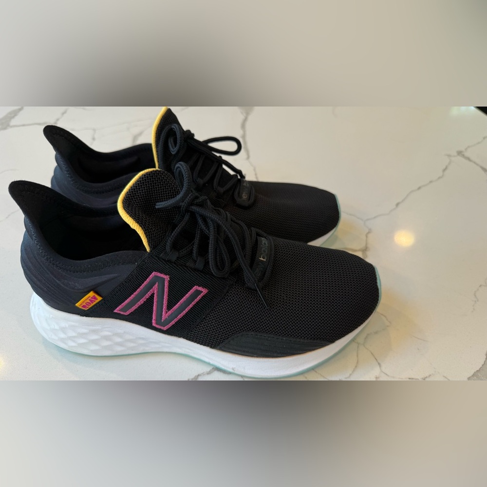 New Balance Black Sneakers with Pink and Yellow Accents